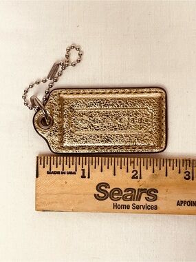 Coach Metallic Gold Hang Tag Bag Charm